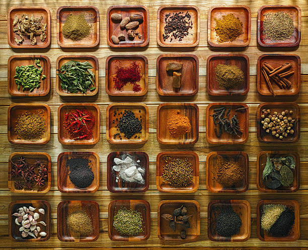 istock Common Indian herbs and spice ingriedients on wooden trays. 500355636