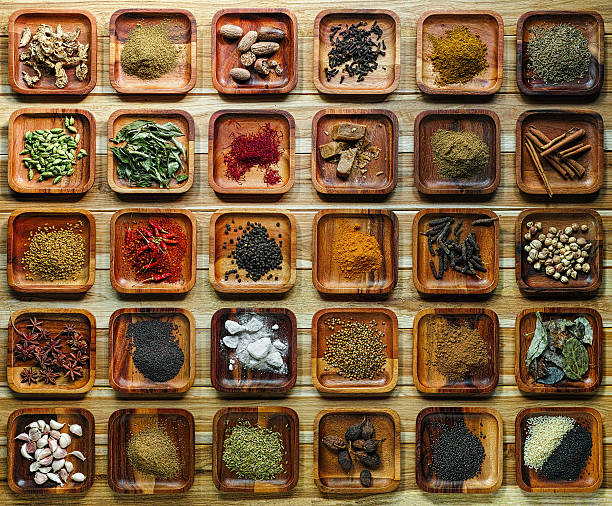 istock Common Indian herbs and spice ingriedients on wooden trays. 500358816