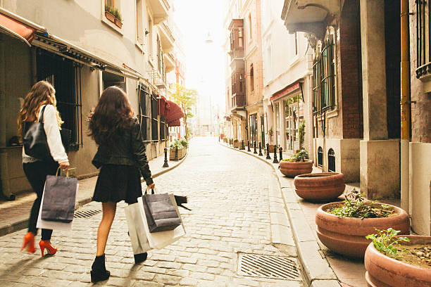 Two cheerful friends hanging around and shopping.