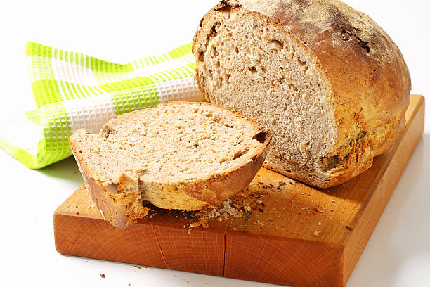 istock Whole grain loaf on a cutting board 500359453