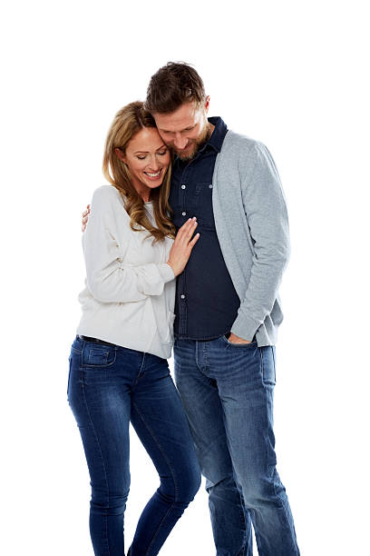 istock Loving couple standing together on white 500361655