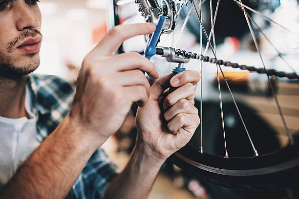 istock Mechanic repairing a bike 500362204