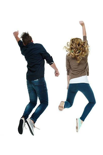 istock Rear view of couple jumping and cheering 500362650