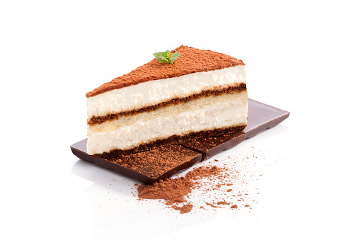 Tiramisu dessert on chocolate bar isolated on white background. Italian sweet dessert concept.