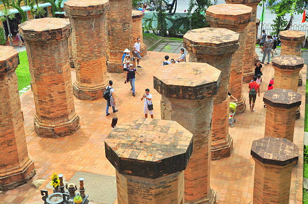 Travellers are visiting the Ponagar temple in Nha Trang Nha Trang, Vietnam - July 11, 2015: Travellers are visiting the Ponagar temple in Nha Trang cham mask stock pictures, royalty-free photos & images