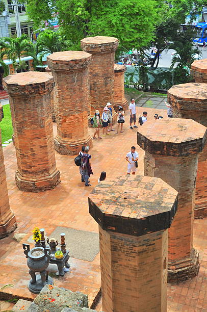 Travellers are visiting the Ponagar temple in Nha Trang Nha Trang, Vietnam - July 11, 2015: Travellers are visiting the Ponagar temple in Nha Trang cham mask stock pictures, royalty-free photos & images