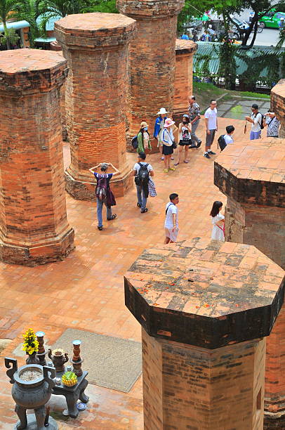 Travellers are visiting the Ponagar temple in Nha Trang Nha Trang, Vietnam - July 11, 2015: Travellers are visiting the Ponagar temple in Nha Trang cham mask stock pictures, royalty-free photos & images