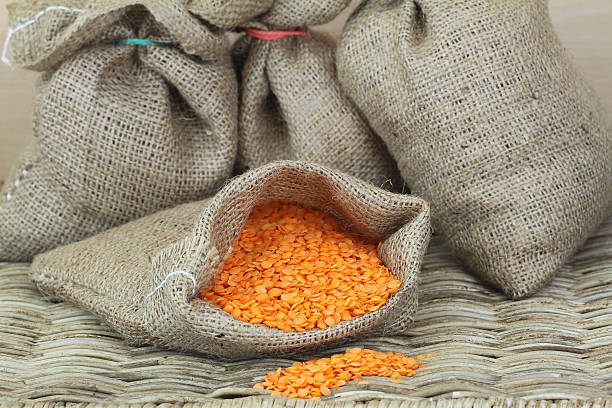 istock Red lentils in jute bag, close up 500363783