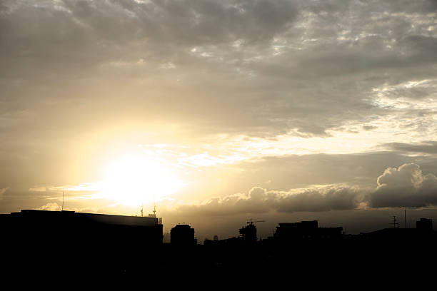 istock Dawn over city silhouette 500364652