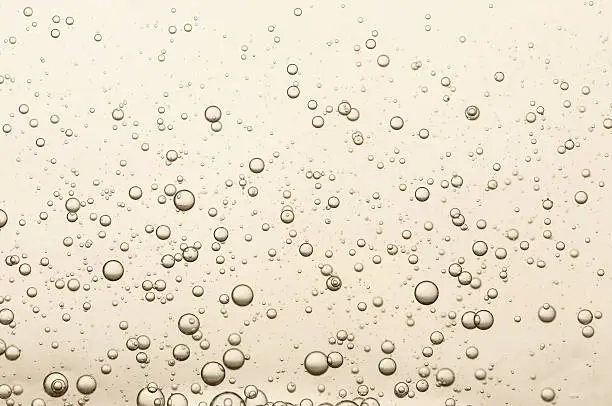 Photo of Many small champagne bubbles