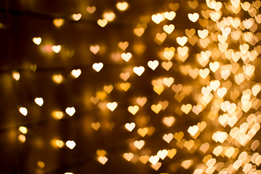 Blurring lights bokeh background of hearts