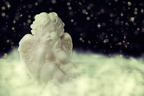 istock Little white guardian angel on dark background. 500366182
