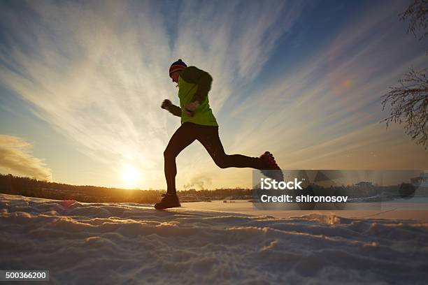 Running In Winter Stock Photo - Download Image Now - 2015, Activity, Adult