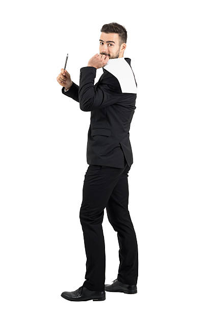 istock Salesman holding contract paper on his back offering pen 500367356