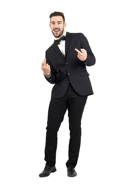 istock Young laughing provocative man in suit showing middle finger gesture 500367580