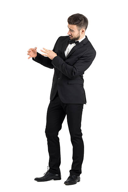 istock Groom with funny expression putting wedding ring on his finger 500368166