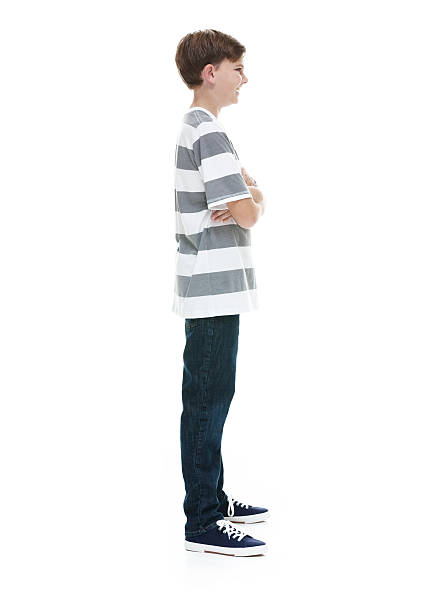 istock Smiling boy standing with arms crossed 500368908