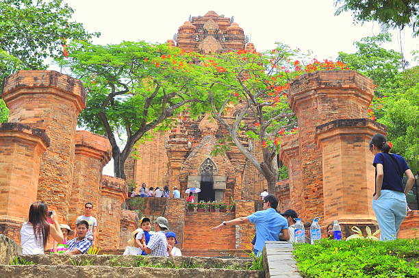 Travellers are visiting the Ponagar temple in Nha Trang Nha Trang, Vietnam - July 11, 2015: Travellers are visiting the Ponagar temple in Nha Trang cham mask stock pictures, royalty-free photos & images