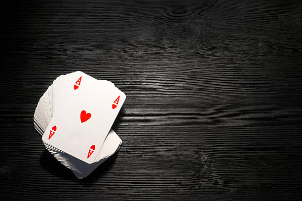 istock Playing cards isolated on black background 500370258