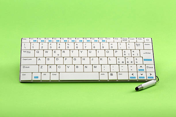 istock White wi fi stylus pen keyboard on green background 500370354