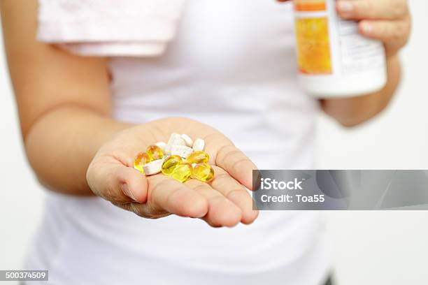 Sport And Diet Concept Woman Hand With Medication Stock Photo - Download Image Now