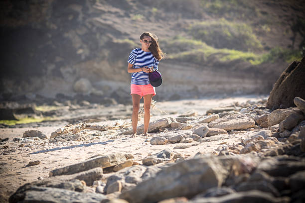 istock Woman Walking on the Beach 500376939