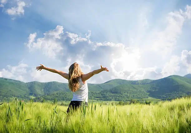 Photo of One young woman Feeling free outdoor in the wheat field