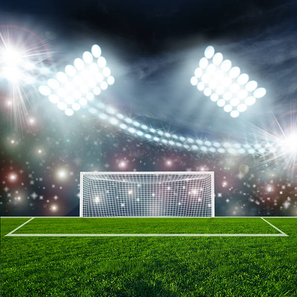 istock Soccer ball on green stadium arena 500379185
