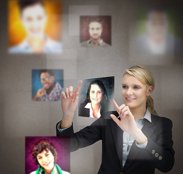 istock Smiling businesswoman adjusting a picture 500387597