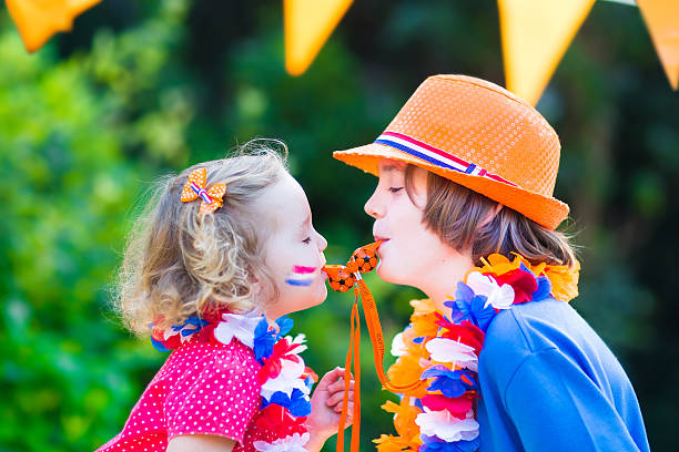istock Two cute kids Dutch football supporters 500387723