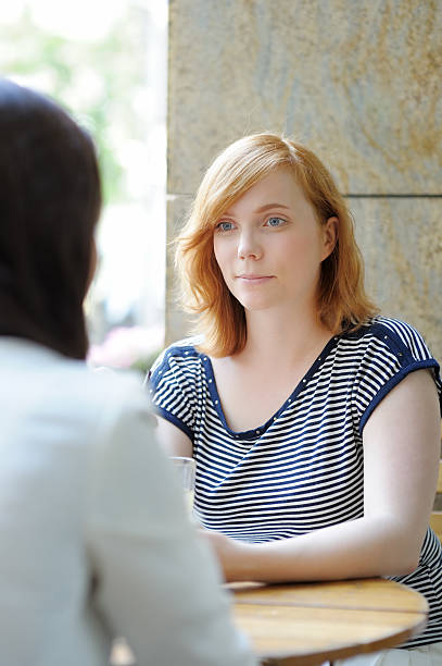 istock Young woman in a outdoor cafe 500388093