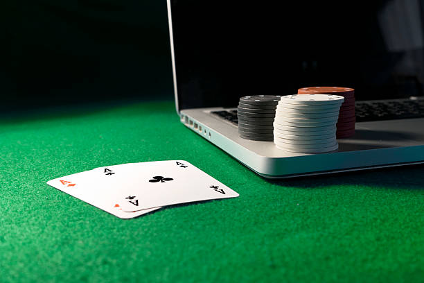 istock Laptop, poker cards and poker chips 500388878