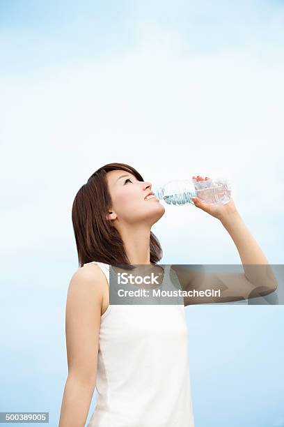 Pretty Asian Girl Drinking Water In The Blue Sky Stock Photo - Download Image Now - Women, Water Bottle, Only Women