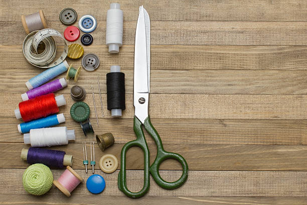 istock sewing kit on left half wooden backgrounds 500389146