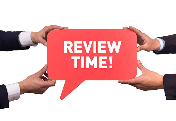 istock Two men holding red speech bubble with REVIEW TIME! message 500389254