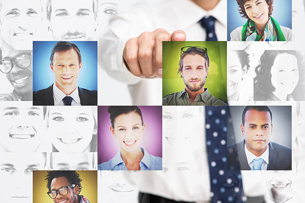 istock Businessman pointing at digital interface presenting profile pictures 500389551