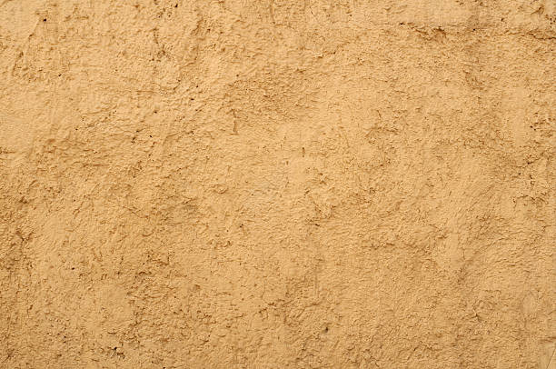 istock Texture of wall with yellow stucco 500389911
