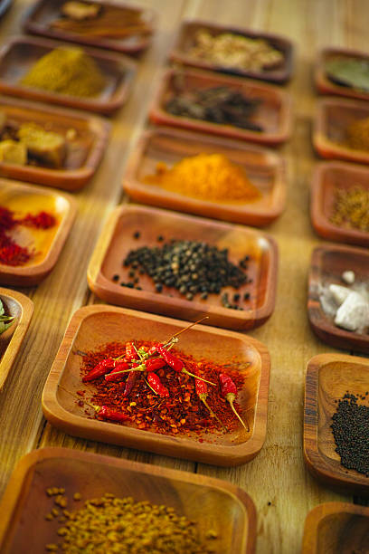 istock Indian spices in wooden trays. 500391454