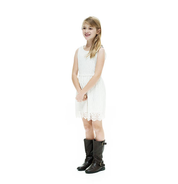 istock Smiling little girl standing and looking away 500391626