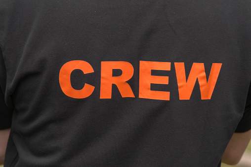 Crew sign on a shirt.