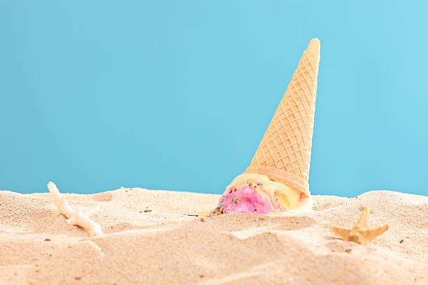 Studio shot of an ice cream splashed on sand