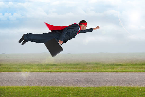 istock superhero businessman flying 500393521