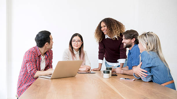 istock Multi racial business people in meeting using laptop 500394096