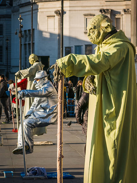 London, United Kingdom - December 28, 2014: Levitating human statues perform in Trafalgar Square, London, during Christmas time.