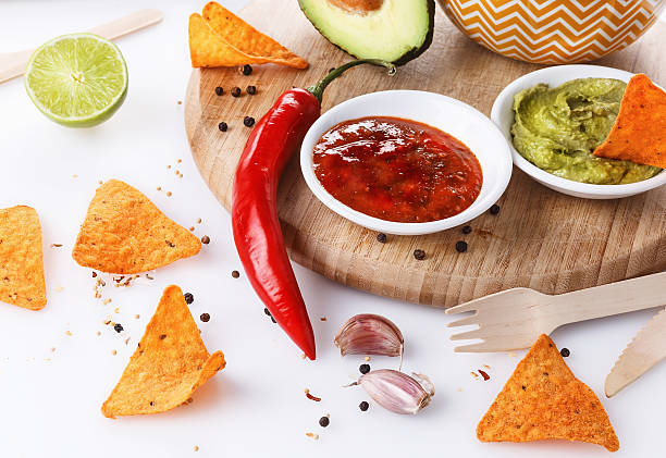 Mexican food concept â Doritos, guacamole and salsa stock photo