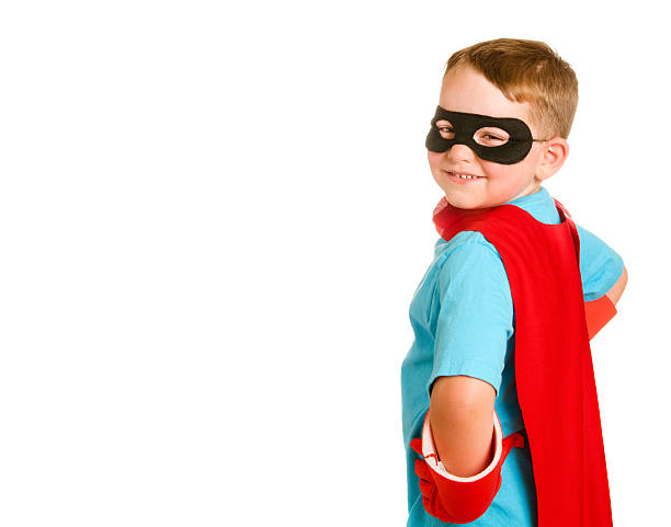 Child pretending to be a superhero stock photo