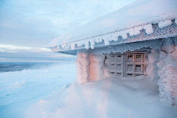istock frozen house in Finland behind arctic circle 500396558