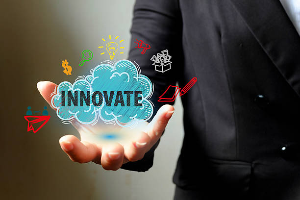 istock INNOVATE concept with icons on hand , business concept 500397332