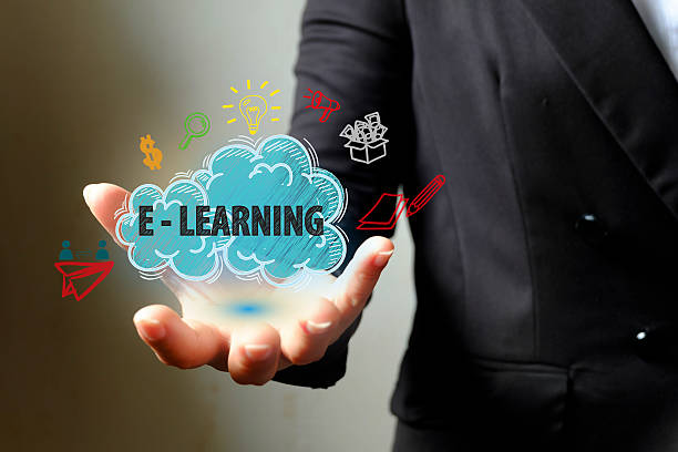 istock E LEARNING  concept with icons on hand , business concept 500399354