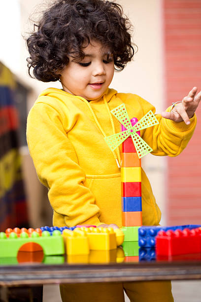 istock Little boy playing with plastic block toys 500401038